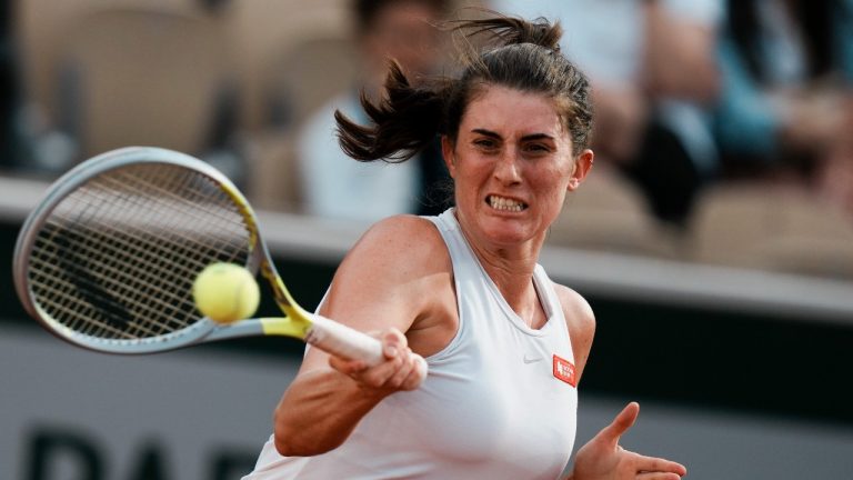 Canada's Rebecca Marino plays a shot against Coco Gauff of the U.S. during their first round match at the French Open tennis tournament in Roland Garros stadium in Paris, France, Sunday, May 22, 2022. (Thibault Camus/AP Photo)