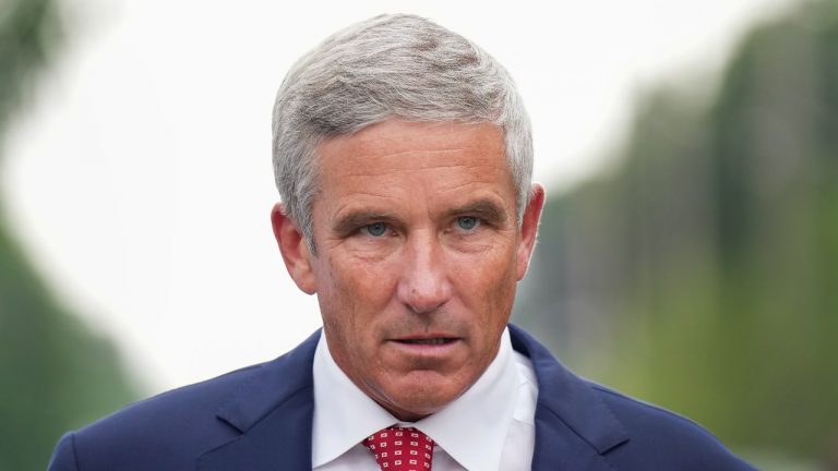 PGA Tour Commissioner Jay Monahan leaves after speaking with sports commentator Jim Nantz, not shown, regarding the LIV Golf tour during fourth round of the Canadian Open at St. George's Golf and Country Club in Toronto on Sunday, June 12, 2022. (Nathan Denette/THE CANADIAN PRESS)