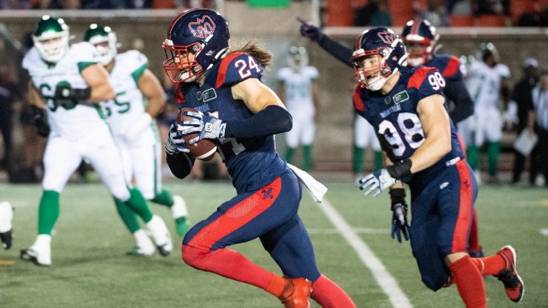 Montreal Alouettes' Marc-Antoine Dequoy (24) runs in for a touchdown during second half CFL football action against the Saskatchewan Roughriders in Montreal, Thursday, June, 23, 2022. (Graham Hughes/CP)