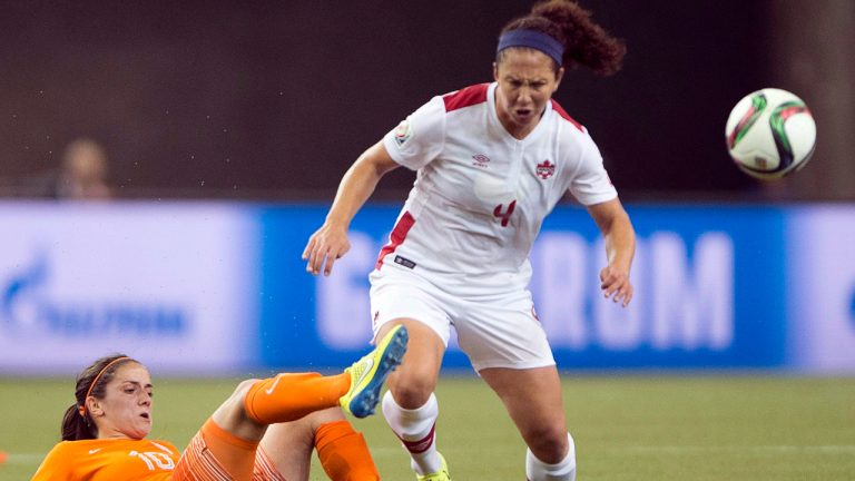 Canada's Carmelina Moscato battles Netherlands' Danielle Van De Donk during first half Women's World Cup soccer Monday, June 15, 2015 in Montreal. (Ryan Remiorz/CP)