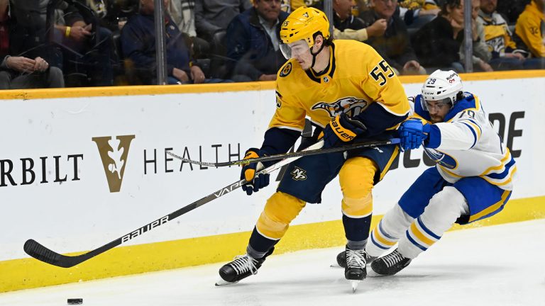 Nashville Predators defenseman Philippe Myers (55) moves the ahead of Buffalo Sabres center Vinnie Hinostroza (29) during the first period of an NHL hockey game. (Mark Zaleski/AP)