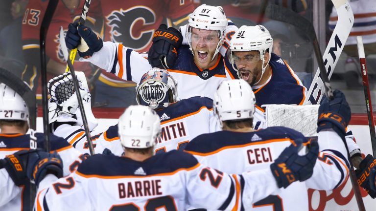 Player profile photo on Edmonton Oilers player Connor McDavid (centre) celebrating with teammates after his winning overtime goal against the Calgary Flames during NHL playoff action in Calgary, Alberta, on May 26, 2022. (Larry MacDougal/CP)