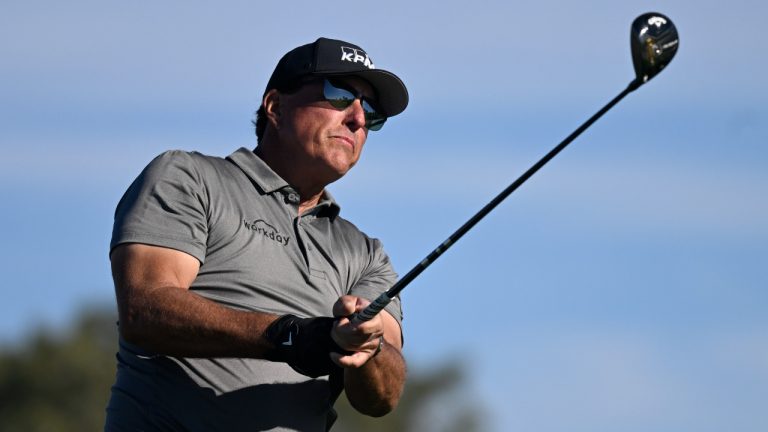 Phil Mickelson hits his tee shot on the fifth hole of the South Course at Torrey Pines during the first round of the Farmers Insurance Open golf tournament, Jan. 26, 2022, in San Diego. Phil Mickelson, the chief recruiter for a Saudi-funded rival league to the PGA Tour, was the last big name to join the 48-man field for the LIV Golf Invitational that starts Friday outside London. It will be Mickelson's first time playing since Feb. 6 at the Saudi International. (Denis Poroy/AP)