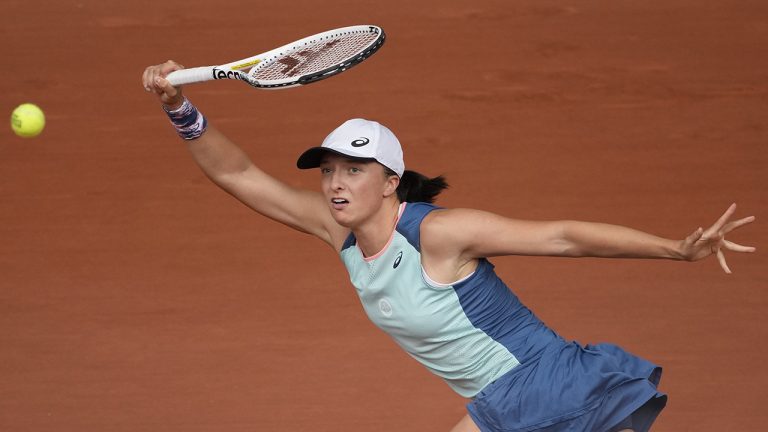 Poland's Iga Swiatek returns the ball to Coco Gauff of the U.S. during the women final match of the French Open tennis tournament at the Roland Garros stadium. (Christophe Ena/AP)