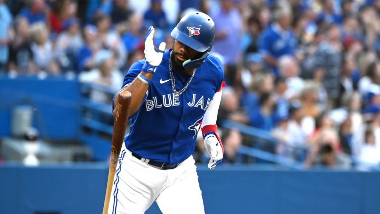 Toronto Blue Jays right fielder Teoscar Hernandez drops his bat after hitting a two RBI double, scoring teammates Bo Bichette and Vladimir Guerrero Jr. against the Boston Red Sox during first inning American League baseball action in Toronto on Tuesday June 28, 2022. (Jon Blacker/THE CANADIAN PRESS)