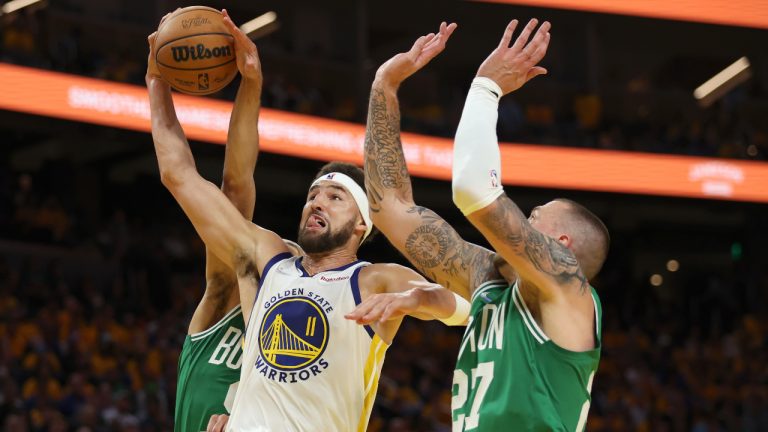 Golden State Warriors guard Klay Thompson (11) shoots against Boston Celtics centre Daniel Theis (27) during the second half of Game 2 of basketball's NBA Finals in San Francisco, Sunday, June 5, 2022. (Jed Jacobsohn/AP)