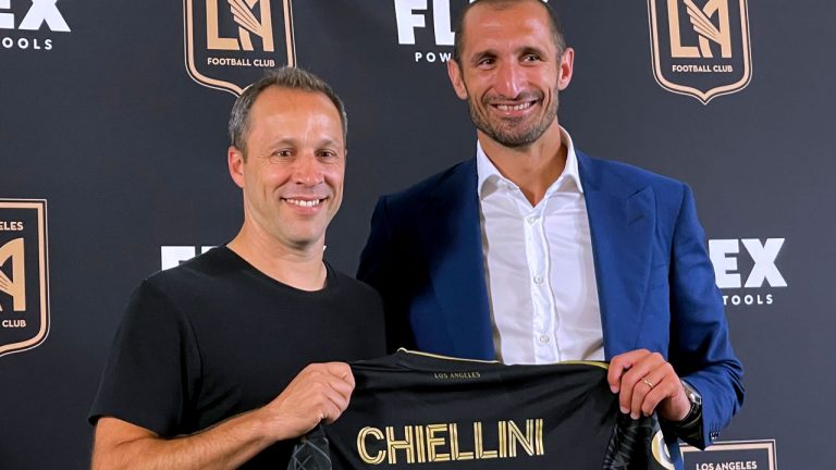 Los Angeles FC coach Steve Cherundolo, left, joins Giorgio Chiellini in Los Angeles during a news conference Wednesday, June 29, 2022, in Los Angeles. Chiellini is coming to the United States and Major League Soccer following 15 years with Juventus. (Joe Reedy/AP)