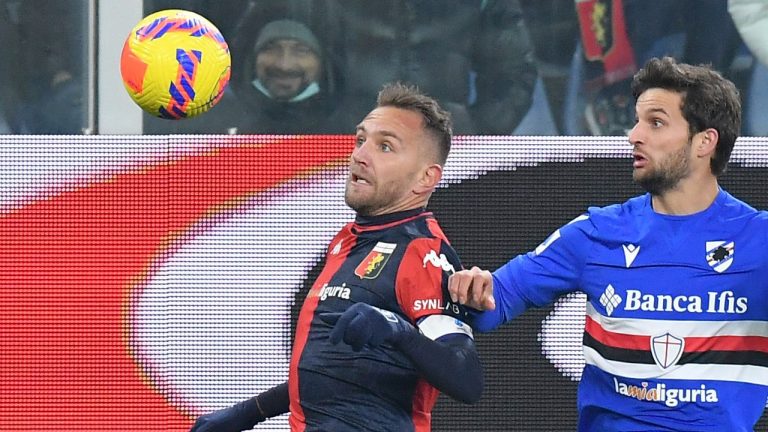 Genoa's Domenico Criscito, left, and Sampdoria's Bartosz Bereszynski in action during the Italian Serie A soccer match between Genoa and Sampdoria at Luigi Ferraris Stadium in Genova, Italy, Friday, Dec. 10, 2021. (Tano Pecoraro/LaPresse via AP)