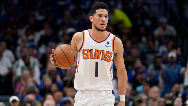 Phoenix Suns guard Devin Booker (1) moves the ball up court against the Dallas Mavericks during the first half of Game 6 of an NBA basketball second-round playoff series, Thursday, May 12, 2022, in Dallas. (Tony Gutierrez/AP)