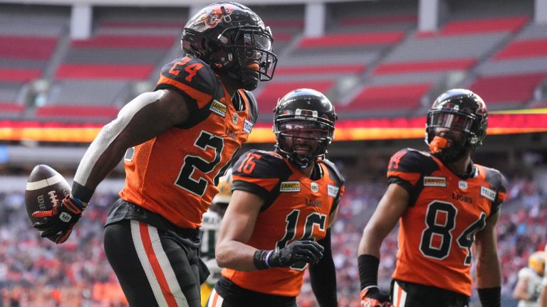 B.C. Lions' James Butler, from left to right, Bryan Burnham and Keon Hatcher celebrate Butler's first touchdown against the Edmonton Elks during the first half of CFL football game in Vancouver, on Saturday, June 11, 2022. (Darryl Dyck/CP)