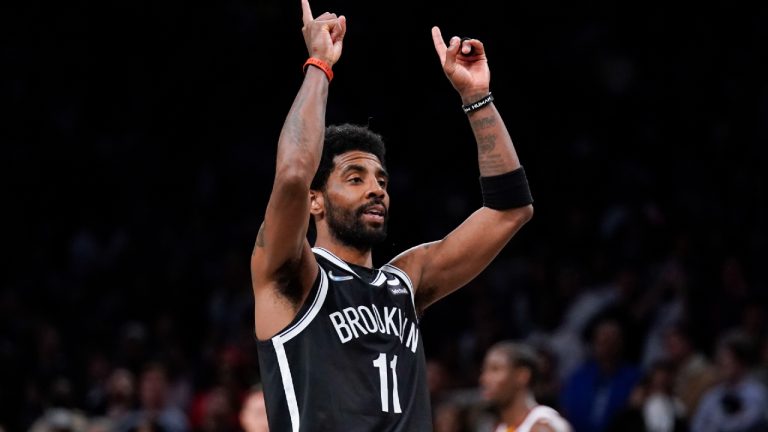 Brooklyn Nets' Kyrie Irving reacts after sinking a basket during the second half of the opening basketball game of the NBA play-in tournament against the Cleveland Cavaliers, Tuesday, April 12, 2022, in New York. (Seth Wenig/AP)