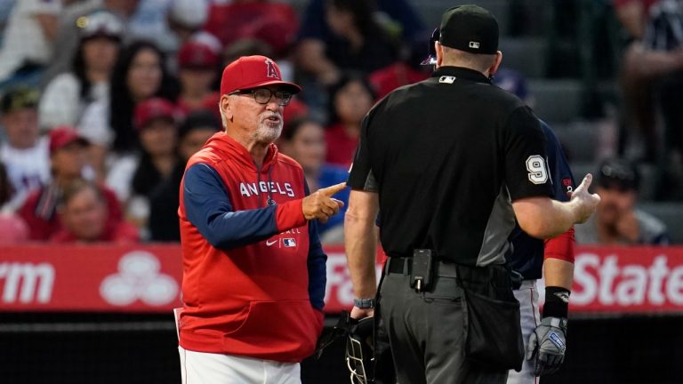 Los Angeles Angels' manager Joe Maddon, left, disputes a stolen base call during the fifth inning of a baseball game against the Boston Red Sox in Anaheim, Calif., Monday, June 6, 2022. (Ashley Landis/AP)