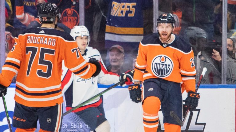 Edmonton Oilers' Brad Malone (24) celebrates his goal on the Washington Capitals with Evan Bouchard (75) during third period NHL hockey action in Edmonton, Alta., on Wednesday March 9, 2022. (Amber Bracken/CP)