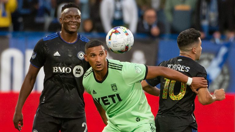 Austin FC defender Ruben Gabrielsen (4) shields the ball as CF Montréal midfielder Victor Wanyama (2) and midfielder Joaquín Torres (10) defend during first half MLS action in Montreal on Saturday, June 18, 2022.
(Peter McCabe/CP)