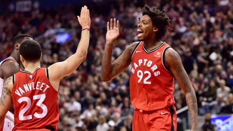 Toronto Raptors centre Lucas Nogueira (92) high-fives guard Fred VanVleet (23) during second half NBA basketball action against the Washington Wizards in Toronto on Sunday, Nov. 5, 2017. (Frank Gunn/CP)