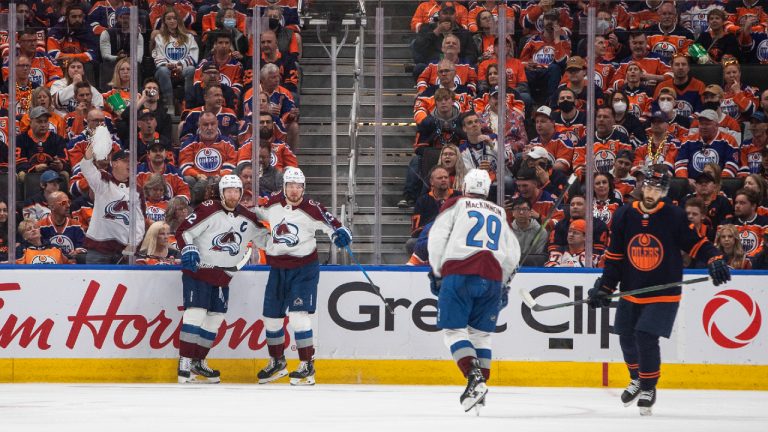 Colorado Avalanche' Gabriel Landeskog (92), Valeri Nichushkin (13) and Nathan MacKinnon (29) celebrate a goal as Edmonton Oilers' Evan Bouchard (75) skates pass during second period NHL conference finals action in Edmonton on Saturday, June 4, 2022. (Jason Franson/CP)