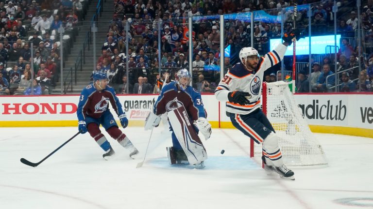 Edmonton Oilers left wing Evander Kane (91) celebrates a goal against Colorado Avalanche goaltender Darcy Kuemper (35) during the first period in Game 1 of the NHL hockey Stanley Cup playoffs Western Conference finals Tuesday, May 31, 2022, in Denver. (Jack Dempsey/AP) 