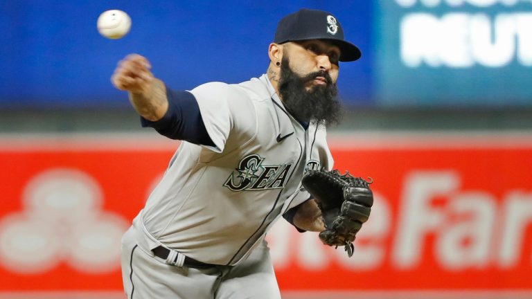 Seattle Mariners relief pitcher Sergio Romo throws to the Minnesota Twins in the sixth inning of a baseball game Monday, April 11, 2022, in Minneapolis. (Bruce Kluckhohn/AP)