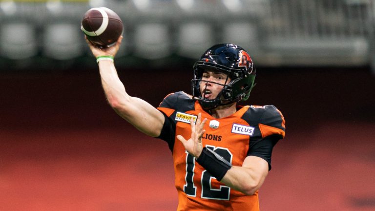 BC Lions' Nathan Rourke throws a pass against the Toronto Argonauts' during second half of CFL football action in Vancouver, B.C., Saturday, June 25, 2022. (Rich Lam/CP)