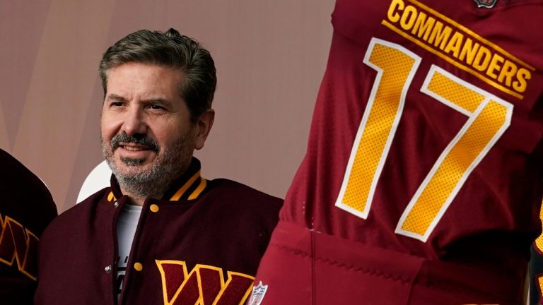 FILE - Dan Snyder, co-owner and co-CEO of the Washington Commanders, poses for photos during an event to unveil the NFL football team's new identity, Wednesday, Feb. 2, 2022, in Landover, Md. A woman accused Washington Commanders owner Dan Snyder of sexually harassing and assaulting her on a team plane in 2009, and the woman was later paid $1.6 million by the team to settle her claims, according to a document obtained by the Washington Post, Tuesday, June 21, 2022. (Patrick Semansky/AP)