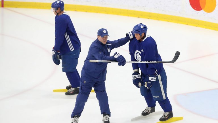 Goaltending coach Steve Briere positions mannequins for a drill as the Toronto Maple Leafs host their mentors road trip in Toronto. (Steve Russell/Getty Images)