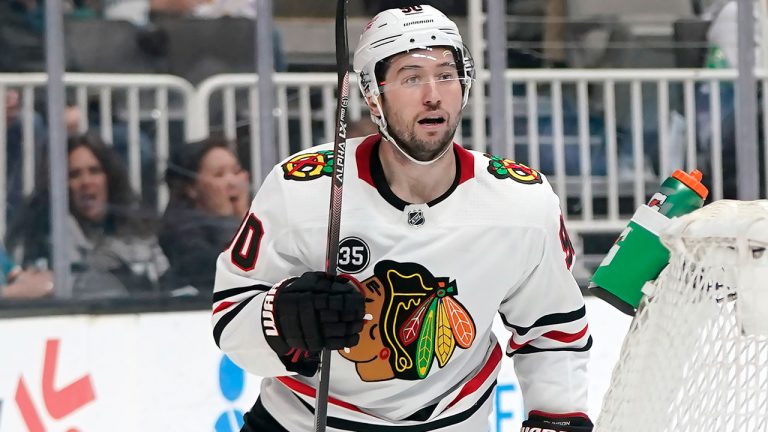 Chicago Blackhawks center Tyler Johnson reacts after scoring against the San Jose Sharks during the second period of an NHL hockey game. (Jeff Chiu/AP)