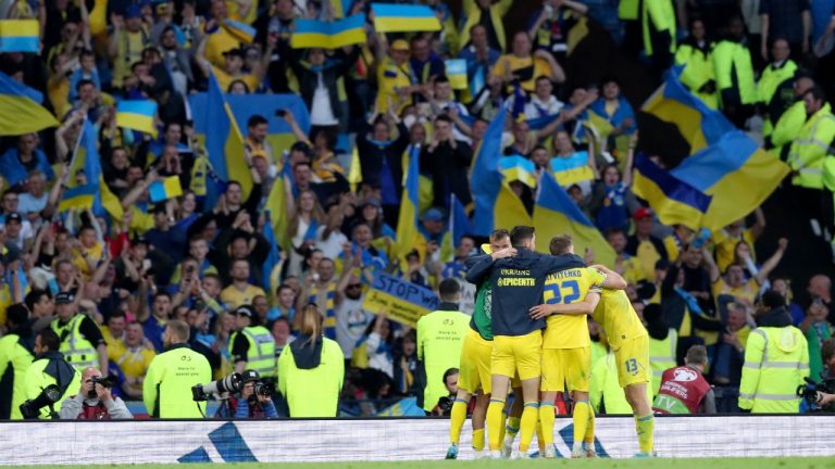 Ukrainian players celebrate at the end of the World Cup 2022 qualifying play-off soccer match between Scotland and Ukraine at Hampden Park stadium in Glasgow, Scotland, Wednesday, June 1, 2022. (Scott Heppell/AP)