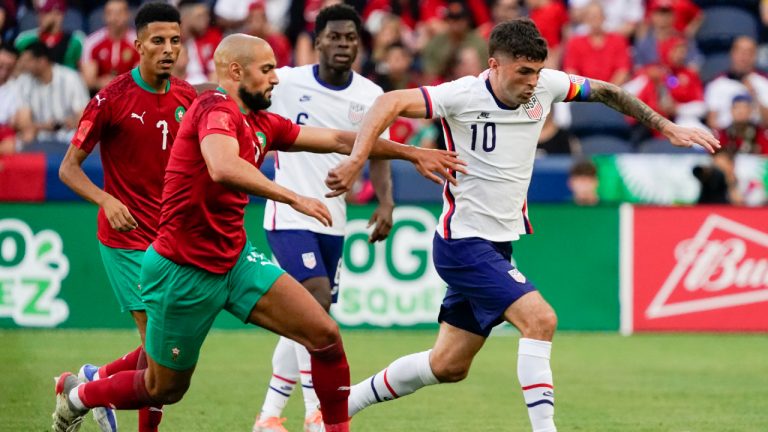 U.S. forward Christian Pulisic (10) dribbles past Morocco's Sofyan Amrabat, front left, during the first half of an international friendly soccer match Wednesday, June 1, 2022, in Cincinnati. (Jeff Dean/AP)