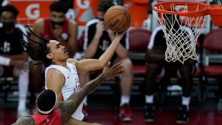 Toronto Raptors' Dalano Banton shoots around Houston Rockets' Marcus Foster during the first half of an NBA summer league basketball game Thursday, Aug. 12, 2021, in Las Vegas. (John Locher/AP)