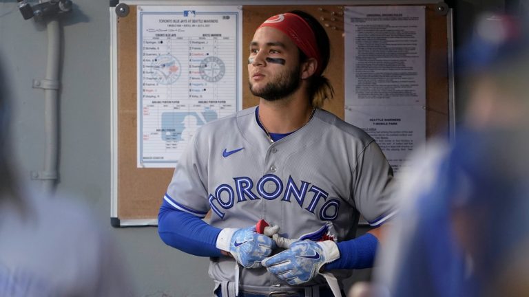 Toronto Blue Jays' Bo Bichette looks out from the dugout after he was called out on strikes during the fourth inning of the team's baseball game against the Seattle Mariners, Friday, July 8, 2022, in Seattle. (Ted S. Warren/AP Photo)