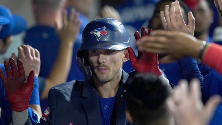 Toronto Blue Jays' Cavan Biggio celebrates his two-run home run in the dugout during the ninth inning of a baseball game against the Chicago White Sox Monday, June 20, 2022, in Chicago. The Blue Jays lost 8-7. (Charles Rex Arbogast/AP)