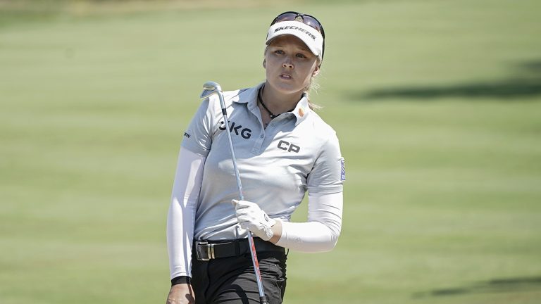 Brooke Henderson, of Canada, follows her ball after playing on the fifth hole. (Laurent Cipriani/AP)