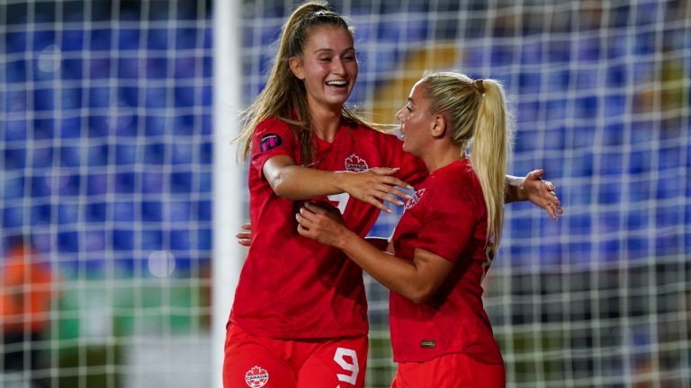 Canada's Adriana Leon, centre, is congratulated after scoring her side's 3rd goal against Jamaica during a CONCACAF Women's Championship soccer semifinal match in Monterrey, Mexico, Thursday, July 14, 2022. (Fernando Llano/AP)