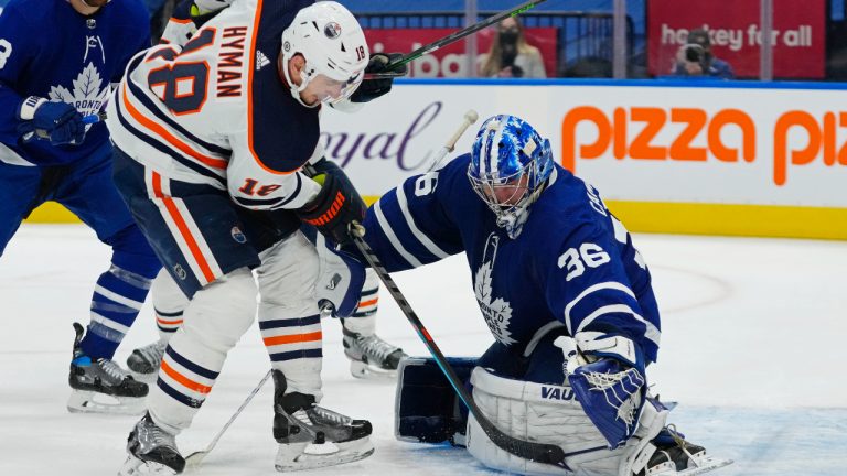 Toronto Maple Leafs goaltender Jack Campbell (36) makes a save on Edmonton Oilers' Zach Hyman (18) during third period NHL hockey action in Toronto on Wednesday, January 5, 2022. THE CANADIAN PRESS/Frank Gunn