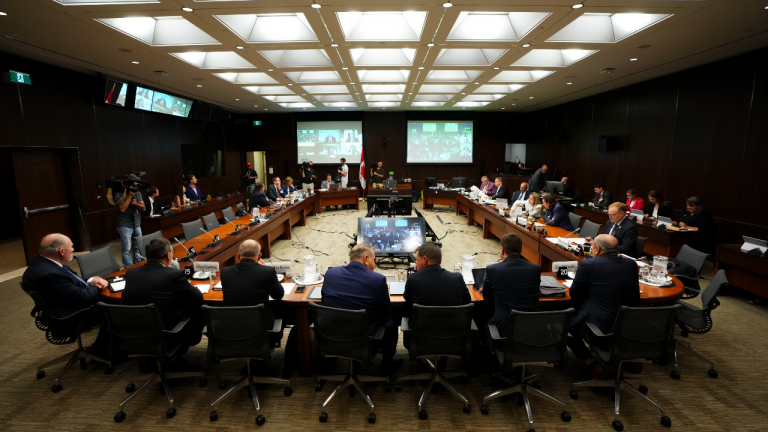 Scott Smith, Hockey Canada President and Chief Operating Officer, middle right, and Hockey Canada Chief Financial Officer Brian Cairo, middle left, join fellow witnesses as they appear at the standing committee on Canadian Heritage in Ottawa on Wednesday, July 27, 2022. (CP)