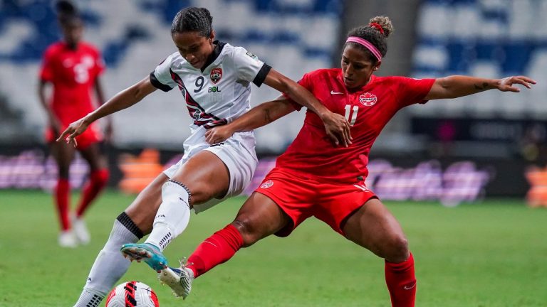 Trinidad and Tobago's Brianna Austin (9) and Canada's Desiree Scott fight for the ball during a CONCACAF Women's Championship soccer match in Monterrey, Mexico, Tuesday, July 5, 2022. (Fernando Llano/AP Photo)