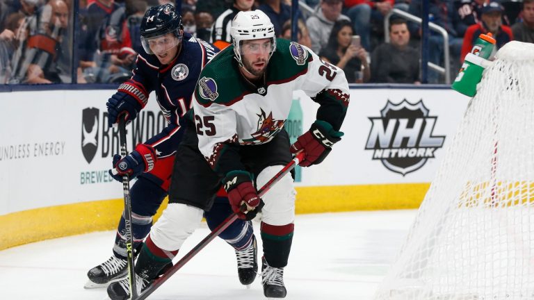 Arizona Coyotes' Conor Timmins, right, looks to pass the puck as Columbus Blue Jackets' Gustav Nyquist defends during the second period of an NHL hockey game Thursday, Oct. 14, 2021, in Columbus, Ohio. (Jay LaPrete/AP)