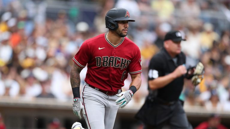 Arizona Diamondbacks' David Peralta, left, watches his solo home run against the San Diego Padres in the sixth inning of a baseball game Sunday, July 17, 2022, in San Diego. (AP Photo/Derrick Tuskan)