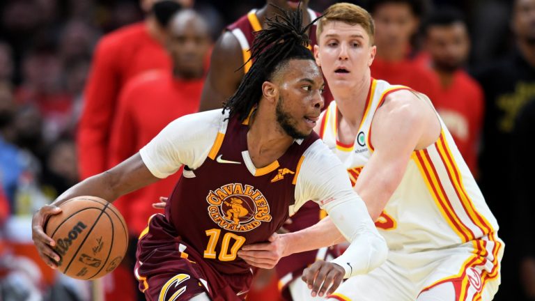 Cleveland Cavaliers' Darius Garland (10) drives against Atlanta Hawks' Kevin Huerter during the second half of an NBA play-in basketball game Friday, April 15, 2022, in Cleveland. (Nick Cammett/AP)