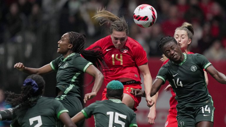 Canada's Vanessa Gilles, centre, vies for the ball against Nigeria's Ifeoma Onumonu, left, and Christy Ucheibe, right, during the second half of a women's friendly soccer match, in Vancouver, on Friday, April 8, 2022. (Darryl Dyck/CP)