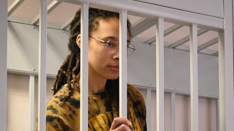 WNBA star and two-time Olympic gold medalist Brittney Griner stands in a cage at a court room prior to a hearing in the Khimki district court, just outside Moscow, Russia, Friday, July 15, 2022. Griner was arrested in February at the Russian capital's Sheremetyevo Airport when customs officials said they found vape canisters with cannabis oil in her luggage. She has been jailed since then, facing up to 10 years in prison if convicted. (Dmitry Serebryakov/AP Photo)