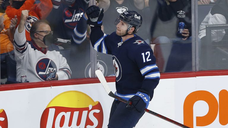 Winnipeg Jets' Jansen Harkins (12) celebrates his goal against the Edmonton Oilers during second period pre-season NHL game action in Winnipeg on Wednesday, September 29, 2021. (John Woods/CP)