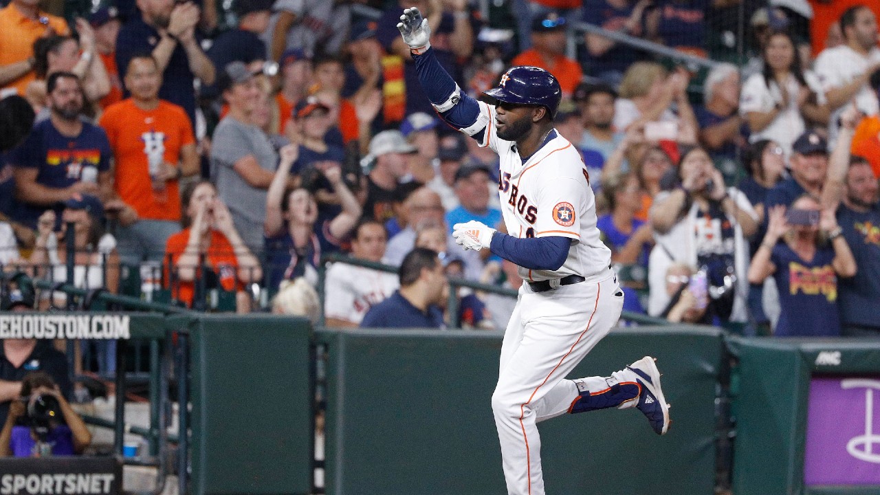 Yordan Alvarez signs home run baseball for fan who caught it