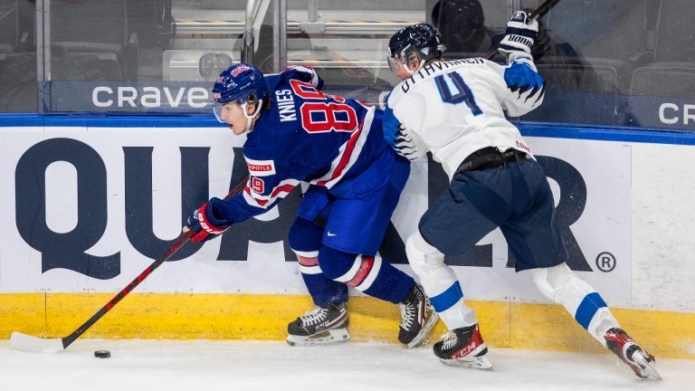 United States' Matthew Knies (89) is checked by Finland's Ville Ottavainen (4) during second period IIHF World Junior Hockey Championship exhibition action in Edmonton on Thursday, December 23, 2021. (Jason Franson/CP)