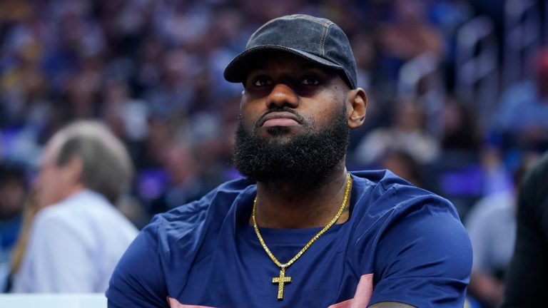 Los Angeles Lakers' LeBron James sits on the bench during the first half of the team's NBA basketball game against the Golden State Warriors in San Francisco, Thursday, April 7, 2022. (Jeff Chiu/AP)