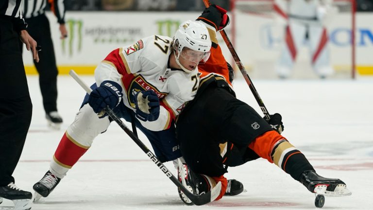 Florida Panthers center Eetu Luostarinen (27) takes control of the puck from Anaheim Ducks center Trevor Zegras during the first period of an NHL hockey game in Anaheim, Calif., Friday, March 18, 2022. (Ashley Landis/AP)