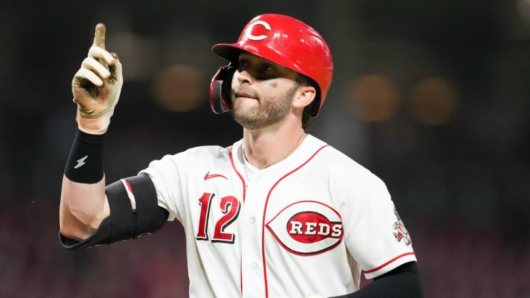 Cincinnati Reds' Tyler Naquin (12) reacts after hitting a solo home run during the sixth inning of the second baseball game of a doubleheader against the Pittsburgh Pirates, Thursday, July 7, 2022, in Cincinnati. (Jeff Dean/AP Photo)