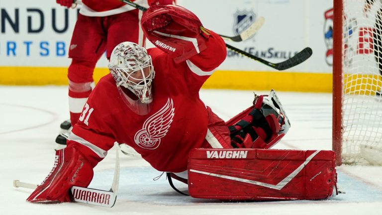 Detroit Red Wings goaltender Calvin Pickard deflects the puck during the third period of an NHL hockey game against the Columbus Blue Jackets, Saturday, March 27, 2021, in Detroit. (Carlos Osorio/AP)