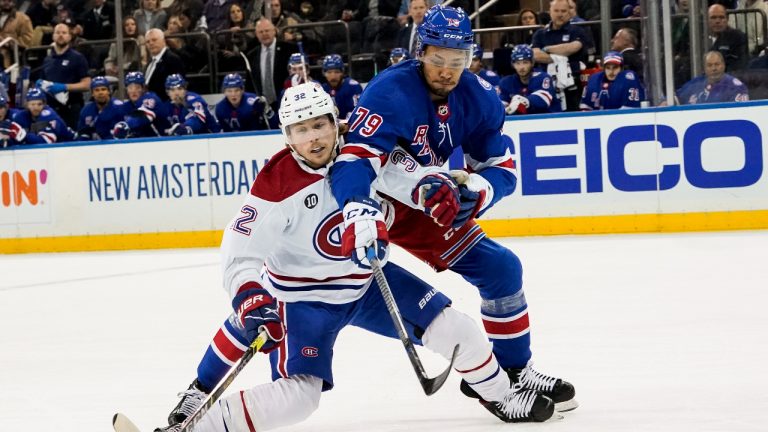 New York Rangers defenceman K'Andre Miller (79) and Montreal Canadiens centre Rem Pitlick (32) battle for the puck during the first period of an NHL hockey game, Wednesday, April 27, 2022, in New York. (John Minchillo/AP)