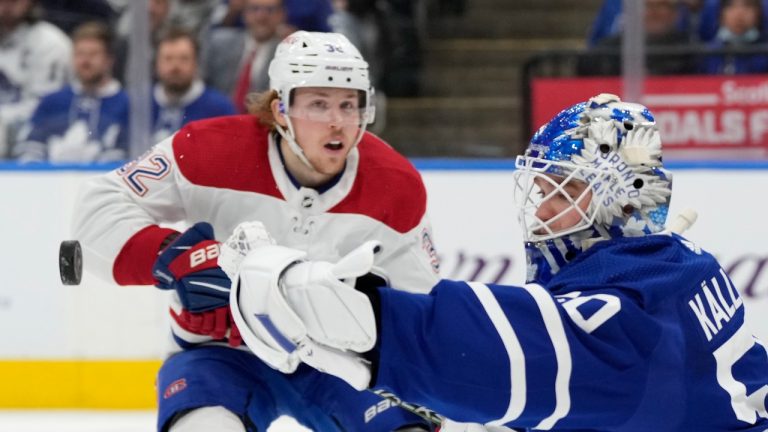 Toronto Maple Leafs goaltender Erik Kallgren (50) makes a save as Montreal Canadiens centre Rem Pitlick (32) looks for a rebound during first period NHL hockey action in Toronto on Saturday, April 9, 2022. (Frank Gunn/THE CANADIAN PRESS)